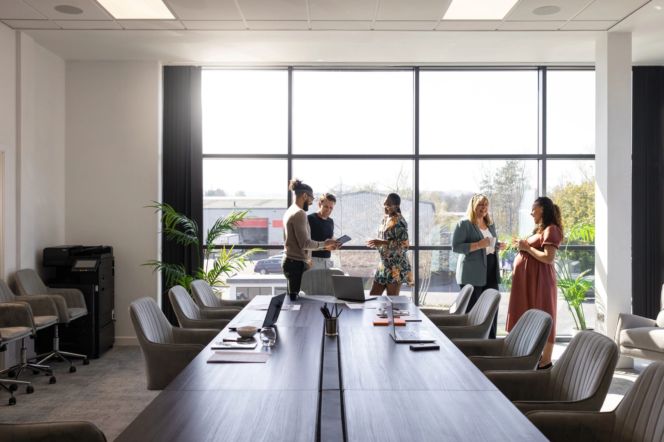 Editorial team in discussion in a modern office