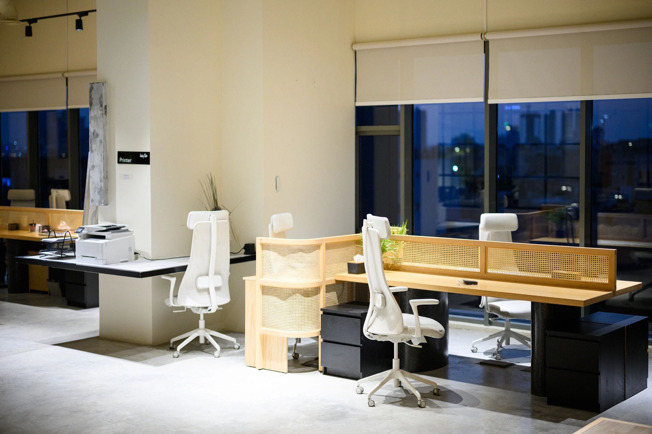 Modern coworking office interior with desks and city view