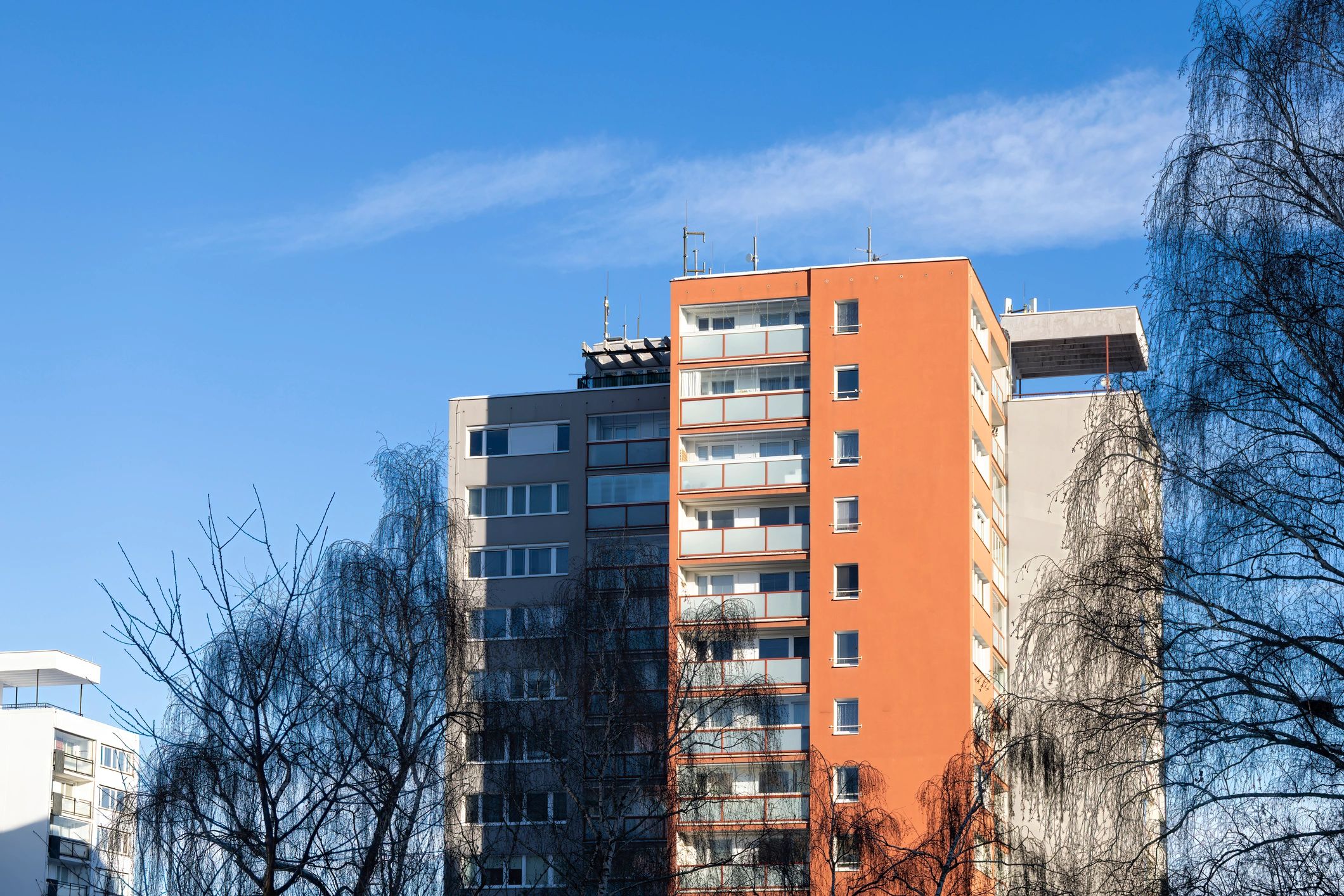 Modern apartment buildings illustrating co-living development