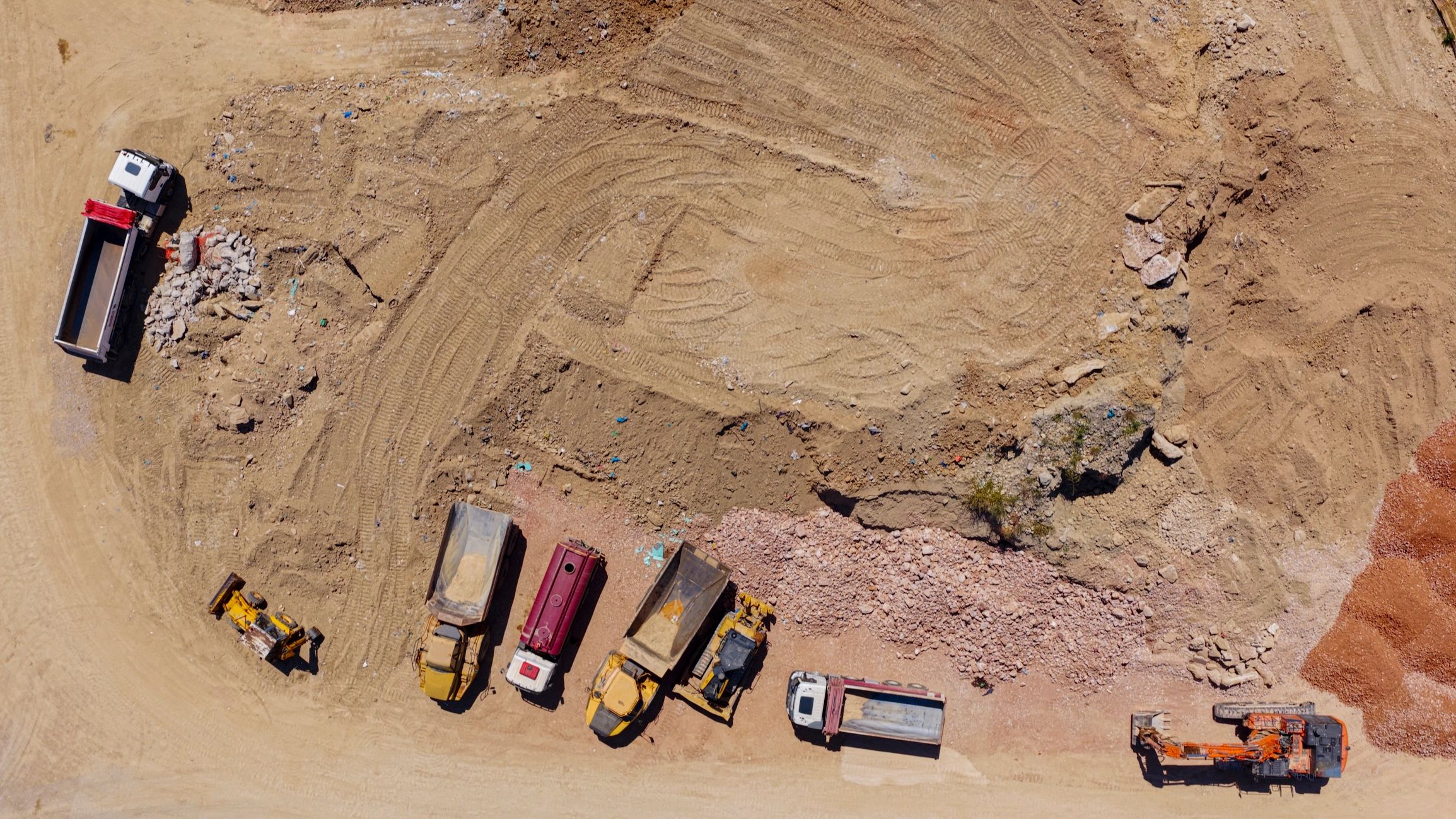 Active construction site with heavy machinery preparing land